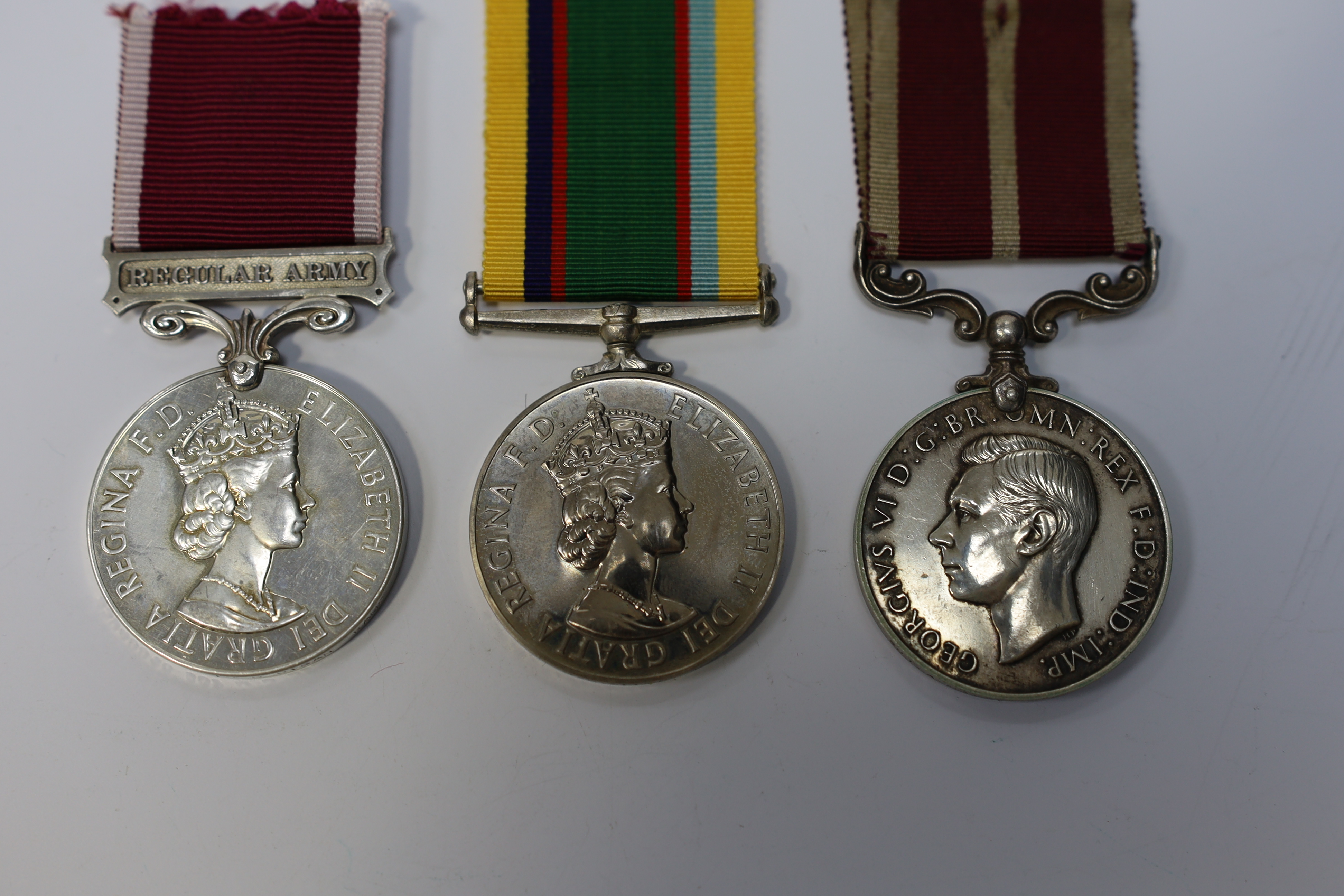 Three assorted service medals; GVI (D) Army Meritorious Service medal to Sjt A.Matheson.R.A.; ERII (A) Army LSGC to 23948816 Sgt M O Digan RAMC; ERII (A) Cadet Forces medal to Sqn.Ldr.J.R.Allen RAFVR(T). Condition - fair